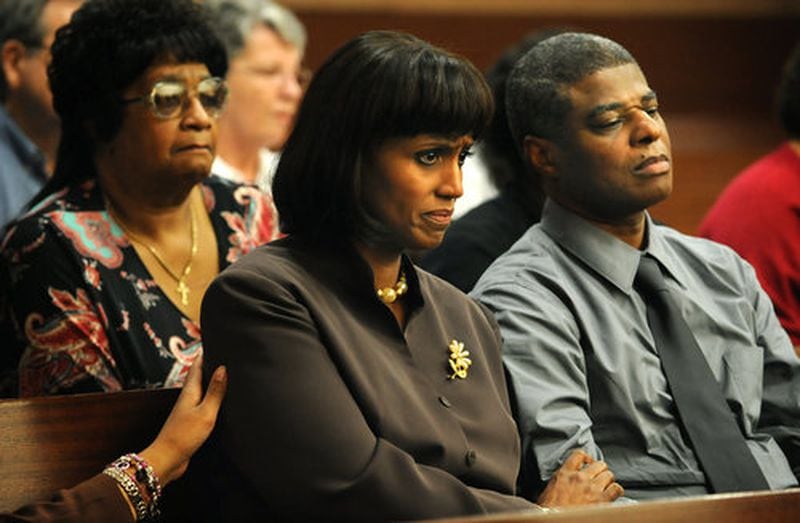 Family members of Sparkle Reid Rai, who was murdered in 2000, listen to evidence presented in Fulton Superior Court during Chiman Rai’s murder trial in 2008. At right is her father, Bennet Reid Jr. Holding his hand is Donna Lowry Reid, Sparkle Reid Rai's stepmother.