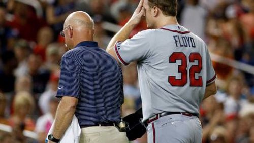 Gavin Floyd leaves game after fracturing pitching elbow Thursday. The swelling was already visible on his right elbow in this picture. (AP photo)