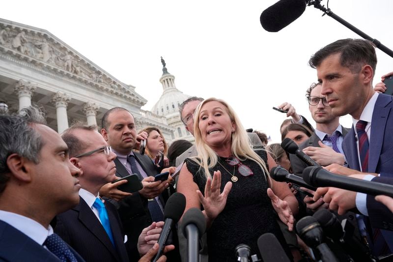Greene speaking to reporters outside the U.S. Capitol on Wednesday.