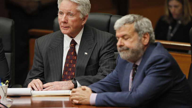 Defense attorney Don Samuel grimances as Tex McIver, left, looks on wide-eyed after the jury found him guilty of felony murder last week. Bob Andres / bandres@ajc.com