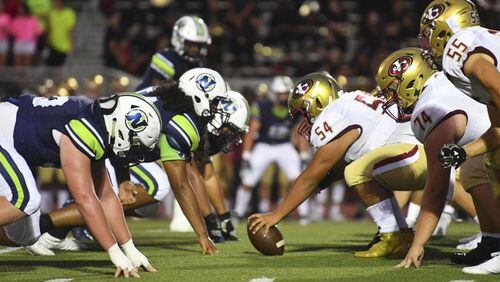 Friday Night football: The Northview defense prepares to battle the Johns Creek offense in the trenches during Friday's matchup in Johns Creek. (John Amis/Special)