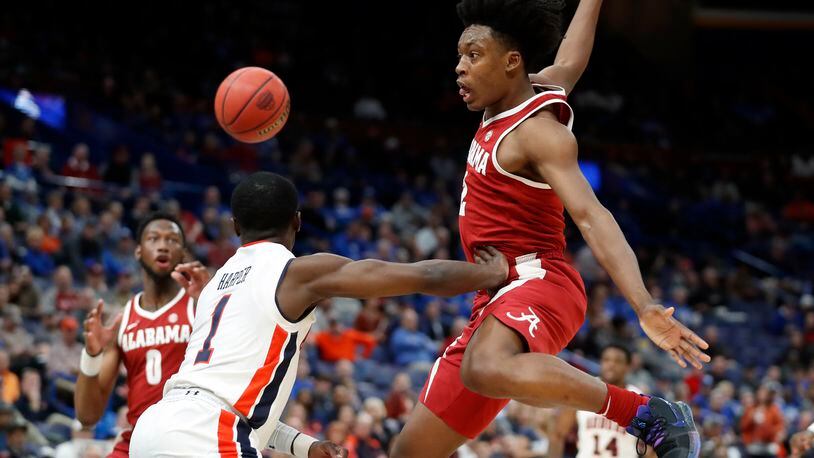 Auburn’s Jared Haper guards Alabama’s Collin Sexton in an SEC tournament game. They are two of six players from Cobb County that will compete in the NCAA tournament.