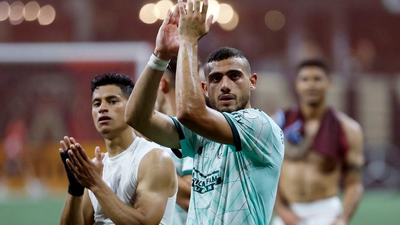 Atlanta United forward Giorgos Giakoumakis (center) and teammates thanked the supporters after the game; Atlanta United defeated Colorado Rapids 4-0 at Mercedes-Benz Stadium on Wednesday, May 17, 2023.Miguel Martinez /miguel.martinezjimenez@ajc.com