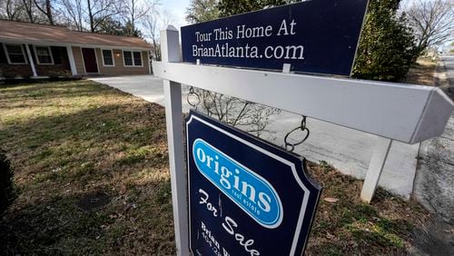A sign announcing a home for sale iin Kennesaw. Experts say that rising mortgage rates are keeping some buyers as well as some sellers out of the market. (AP Photo/Mike Stewart, File)