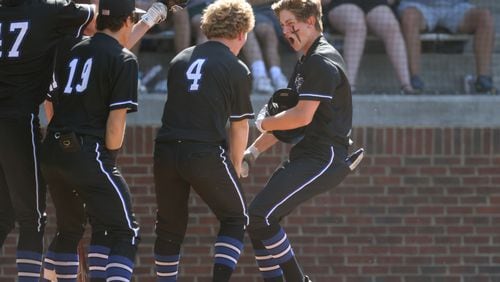 051722 Peachtree Corners: Mount Paran’s Tate McKee, right, celebrates his three-run home run with teammates during the third inning against Wesleyan in game three of the Private A semifinal playoff series at Wesleyan School Tuesday, May 17, 2022, in Peachtree Corners, Ga. Wesleyan won 7-6 to advance to play in the Private A championship next week. (Jason Getz / Jason.Getz@ajc.com)a