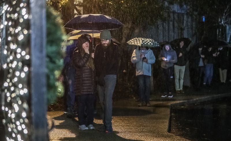 Voters lined up in the rain at Park Tavern in Atlanta before polls opened Tuesday.