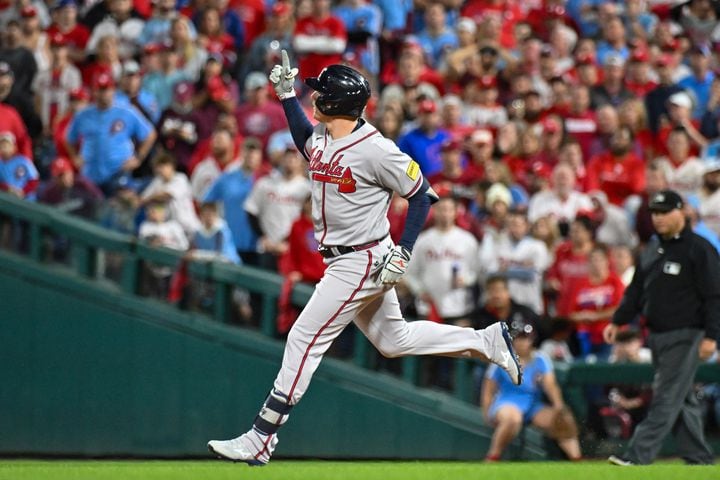 Atlanta Braves’ Austin Riley hits a solo home run against the Philadelphia Phillies during the fourth inning of NLDS Game 4 at Citizens Bank Park in Philadelphia on Thursday, Oct. 12, 2023.   (Hyosub Shin / Hyosub.Shin@ajc.com)