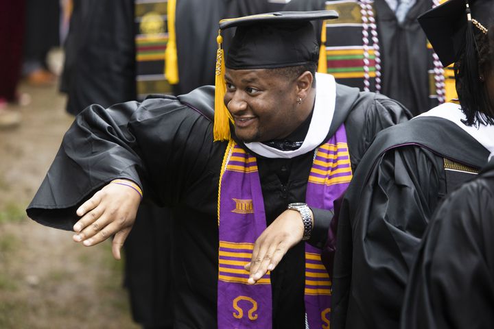Tyler Hunter spots a fraternity brother during the Morehouse College commencement ceremony on Sunday, May 21, 2023, on Century Campus in Atlanta. The graduation marked Morehouse College's 139th commencement program. CHRISTINA MATACOTTA FOR THE ATLANTA JOURNAL-CONSTITUTION