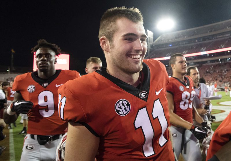 Georgia quarterback Jake Fromm walks off the field after a Bulldogs victory against Appalachian State, Saturday, Sept. 2, 2017, in Athens.  (AP Photo/John Amis)