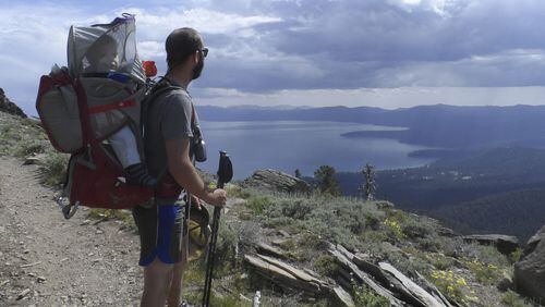 Matt Kinney of Sacramento looks out over the Tahoe Rim Trail in July 2015 with his 11-month-old son, Thomas. Kinney, his wife and Thomas backpacked the trail for 12 days. (Courtesy Kinney family)