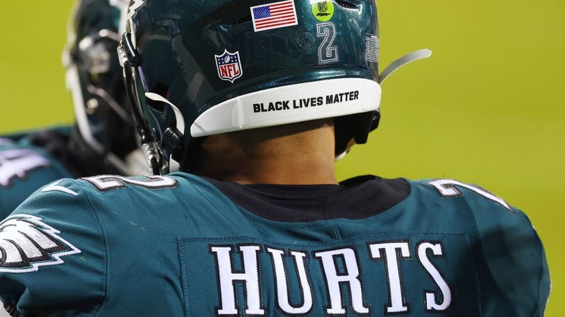 Philadelphia Eagles Jalen Hurts wears a Black Lives Matter decal on the back of his helmet  Jan. 3, 2021, against the Washington Football Team in Philadelphia. NFL players can wear social justice messages on their helmets again the 2021 NFL season and “It Takes All of Us” and “End Racism” will be stenciled in end zones for the second straight year as part of the league’s Inspire Change platform. (Rich Schultz/AP)