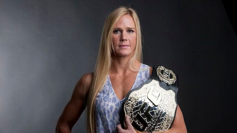 Mixed martial arts fighter Holly Holm with her UFC Women's Bantamweight Champion belt in New York, Nov. 23, 2015. Though she was one of the best boxers in the world for years, it took a move to mixed martial arts and a stunning kick to the head that defeated “unbeatable” Ronda Rousey to make Holm the woman of the moment in the MMA world. (Earl Wilson/The New York Times)