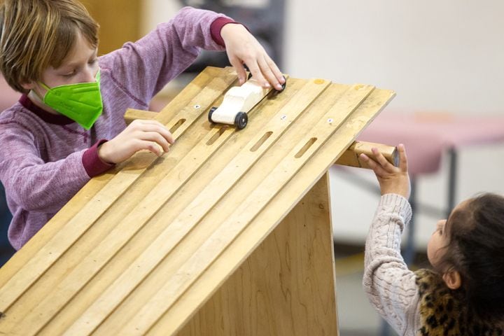 Cub Scouts building pinewood derby cars