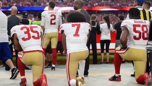 Eric Reid and Colin Kaepernick kneel during the national anthem before a game during the 2016 season.