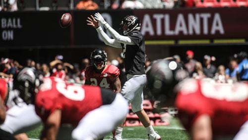 Atlanta Falcons quarterback Matt Ryan (2) takes a snap during open practice Sunday, July 29, 2018, at Mercedes-Benz Stadium in Atlanta.