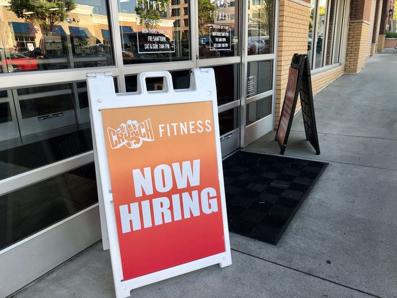 Signs advertise openings at a Crunch Fitness gym in Dunwoody on Thursday, April 21, 2022. J. SCOTT TRUBEY