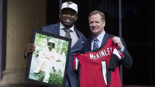 Takkarist McKinley (UCLA) poses with NFL commissioner Roger Goodell as he holds a photo of his grandmother as he is selected as the number 26 overall pick to the Atlanta Falcons in the first round the 2017 NFL Draft at the Philadelphia Museum of Art.