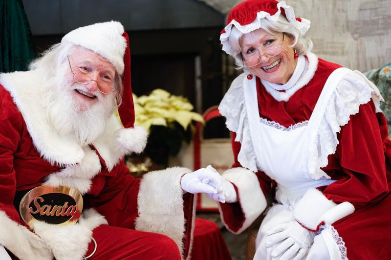 Trisha Senterfitt was inspired to become Mrs. Claus when she saw children's faces light up at the sight of Santa (her husband Jack Senterfitt). (Natrice Miller/ Natrice.miller@ajc.com)
