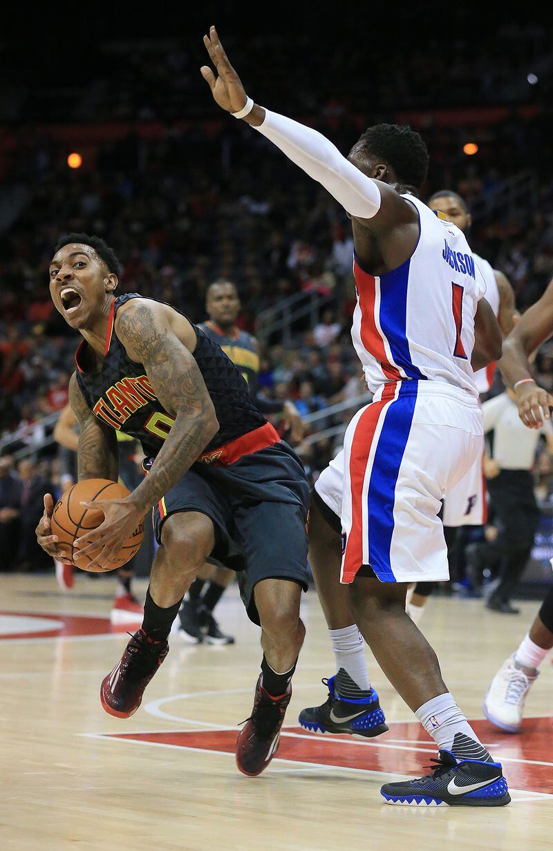 102715 ATLANTA: -- Hawks Jeff Teague collides with Pistons Reggie Jackson during the first period in their first regular season basketball game "home opener" on Tuesday, Oct. 27, 2015, in Atlanta. Curtis Compton / ccompton@ajc.com