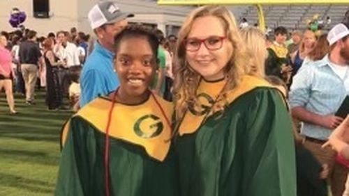 Kennedy Sanders, left, and Emily Middleton at their graduation from Ware County High School in Georgia in 2017.