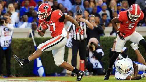 Nick Chubb of the Georgia Bulldogs runs for a touchdown during the first half against the Kentucky Wildcats at Sanford Stadium on November 18, 2017 in Athens, Georgia. (Photo by Daniel Shirey/Getty Images)