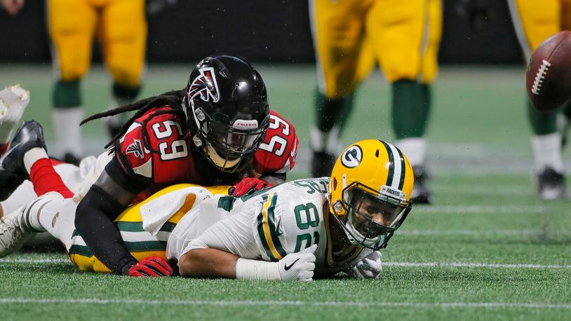 9/17/17 - Atlanta, GA -  Atlanta Falcons linebacker De'Vondre Campbell breaks up a second half pass intended for Green Bay Packers tight end Richard Rodgers .  Atlanta Falcons vs Green Bay Packers.   The Falcons opened the roof for the Falcons season opener at Mecedes-Benz Stadium.   BOB ANDRES  /BANDRES@AJC.COM