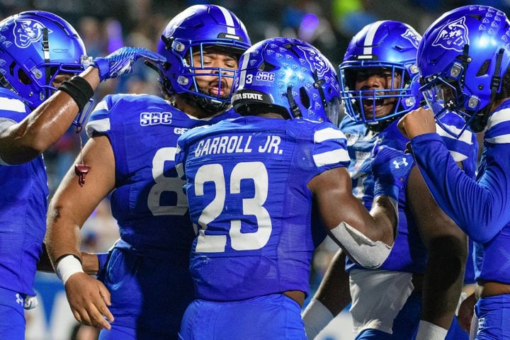 His Georgia State teammates celebrate a touchdown by Marcus Carroll against Troy Saturday, Sept. 30, 2023 (Jamie Spaar for the Atlanta Journal Constitution)