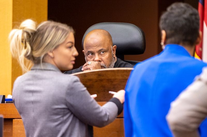 (L-R) Attorney Nicole Moorman, Judge Ural Glanville, and Deputy District Attorney Adriane Love confer during the probation revocation hearing of Quantavious Grier, brother of rapper Young Thug, at Fulton County court in Atlanta on Monday, June 5, 2023. (Arvin Temkar / arvin.temkar@ajc.com)