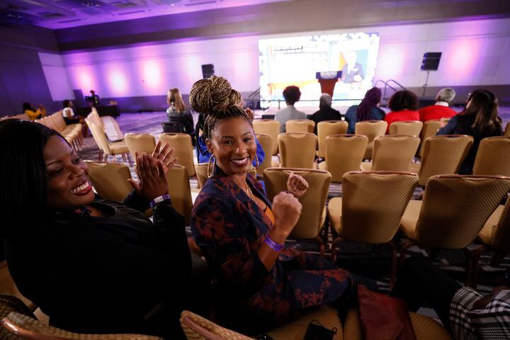 April Graham, right, and Tamara Henson react after seeing the numbers from the screen from the senate and governor race during the election night watch party at the Hyatt Regency in Atlanta on Tuesday, November 8, 2022.
Miguel Martinez / miguel.martinezjimenez@ajc.com