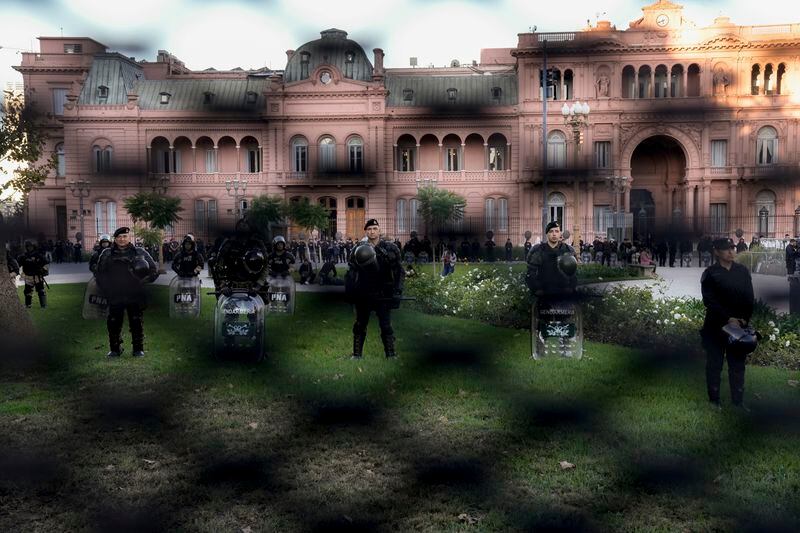 Police guard the Casa Rosada presidential palace during a march by demonstrators demanding more funding for public universities and to protest against austerity measures proposed by President Javier Milei, in Buenos Aires, Argentina, Tuesday, April 23, 2024. (AP Photo/Rodrigo Abd)