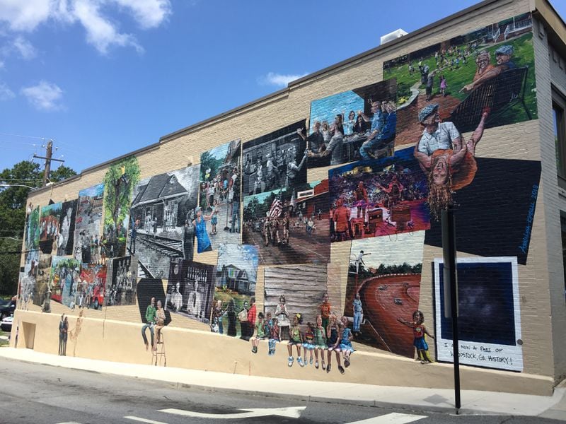 This community mural recently was created on the Mill Street facing wall of the century old Woodstock Pharmacy building. Artist AnnaLysa Kimball interviewed local residents and worked with the town historian and photos to create this work of public art in which everyone depicted is a real person. (City of Woodstock)