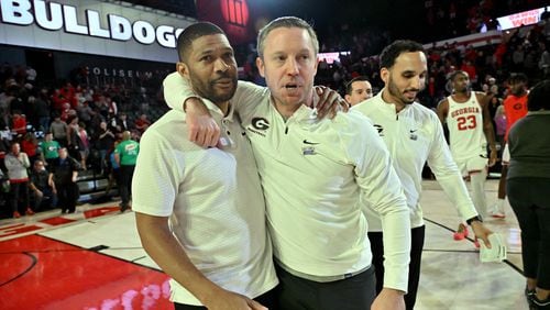 Georgia coach Mike White (right) celebrates with assistant coach Akeem Miskdeen after Georgia beat LSU during an NCAA college basketball game at Stegeman Coliseum, Wednesday, January 24, 2024, in Athens. Georgia won 68-66 over LSU. (Hyosub Shin / Hyosub.Shin@ajc.com)
