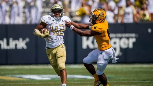 Georgia Tech defensive end Jordan Domineck wards off Kennesaw State quarterback Xavier Shepherd on a 70-yard fumble return for a touchdown in the Yellow Jackets' 45-17 win over the Owls September 11, 2021 at Bobby Dodd Stadium. (Danny Karnik/Georgia Tech Athletics)