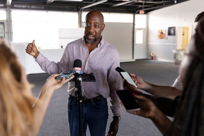Sen. Raphael Warnock speaks to the media after a rally in Atlanta, GA, on Saturday, July 23, 2022.  on Saturday, July 23, 2022.   (Bob Andres for the Atlanta Journal Constitution)