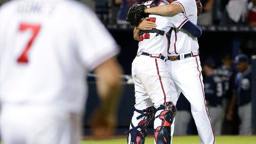 Braves reliever Jason Grilli hugs catcher Christian Bethancourt after closing out the ninth inning in the Braves' 6-5 win over San Diego Tuesday night. (AP Photo/David Goldman)