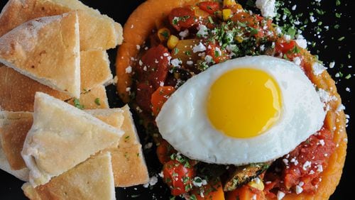 Shakashuka -- stewed peppers, tomato, okra, jalapenos, corn, sweet potato, feta, fried egg and flat bread at Dish Dive in Kirkwood. Read more about Dish Dive here. (Beckysteinphotography.com))