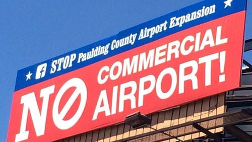 Anti-airport commercialization billboards have gone up in Paulding County.