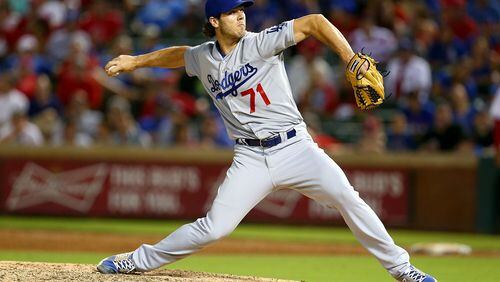 Josh Ravin of the Dodgers pitches in the ninth inning during a game against the  Rangers at Globe Life Park in Arlington on June 16, 2015 in Arlington, Texas. The Braves acquired Ravin in November 2017. (Photo by Sarah Crabill/Getty Images)