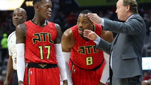 Hawks center Dwight Howard and guard Dennis Schroder were at the center of coach Mike Budenholzer’s rebuild plans in the offseason, but the results have been mixed. (Curtis Compton/ccompton@ajc.com)