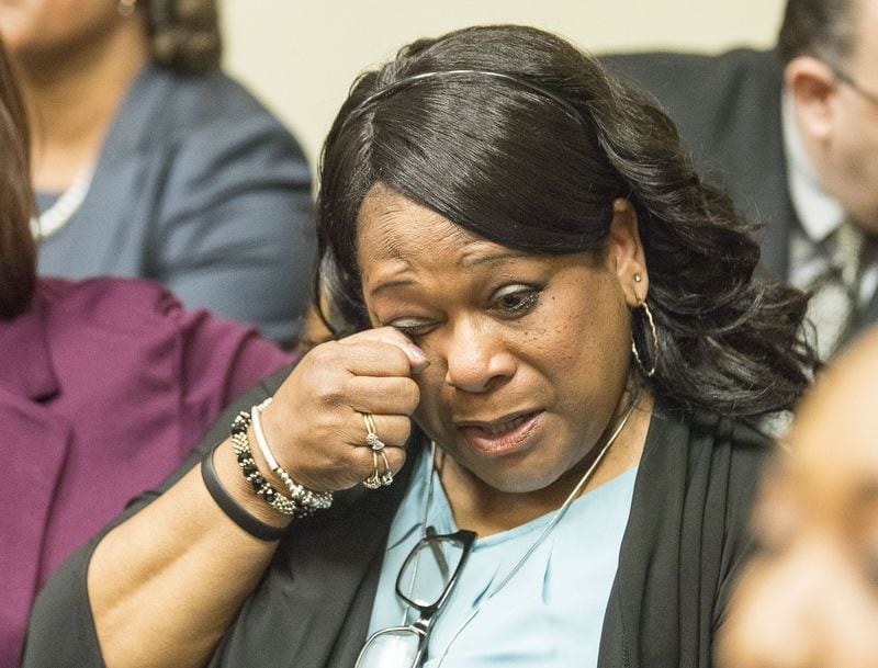 10/14/2019 — Decatur, Georgia — Carolyn Baylor Giummo, mother of Anthony Hill, reacts as the jury reads the verdict for the Robert “Chip” Olsen trial in front of DeKalb County Superior Court Judge LaTisha Dear Jackson at the DeKalb County Courthouse in Decatur, Monday, October 14, 2019. On the sixth day of jury deliberations the jury found Robert “Chip” Olsen not guilty of felony murder. But jurors reached guilty verdicts on four lesser charges: two counts of violation of oath of office, aggravated assault and making a false statement. (Alyssa Pointer/Atlanta Journal Constitution)