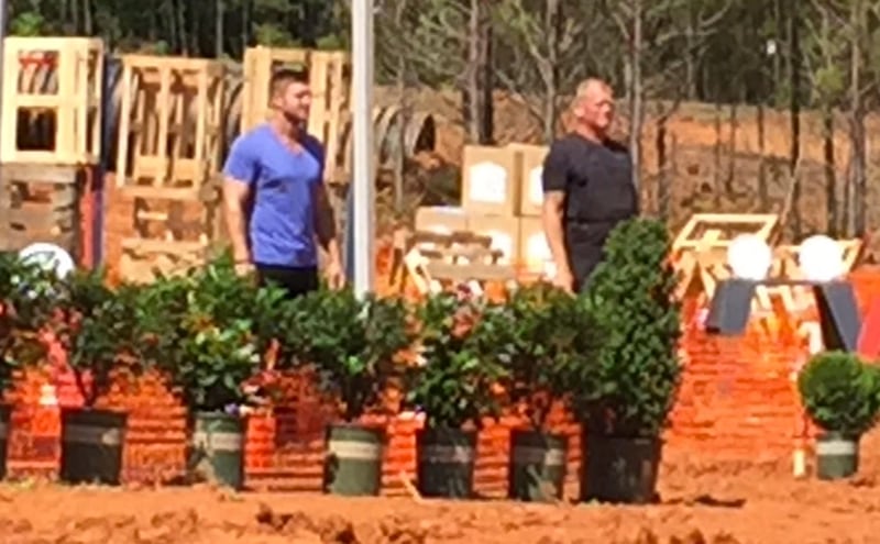 Tim Tebow and Mike Holmes on one of the big challenge courses the creators set up. CREDIT: Rodney Ho/ rho@ajc.com