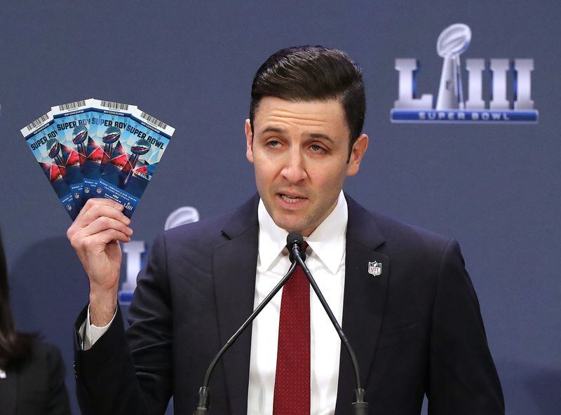 Michael Buchwald, NFL Senior Counsel, Legal, holds up real Super Bowl tickets during the National Football League and law enforcement agencies press conference announcing the latest results of seizures of counterfeit game-related merchandise and tickets during a press conference at the Georgia World Congress Center on Thursday, Jan. 31, 2019, in Atlanta.   Curtis Compton/ccompton@ajc.com