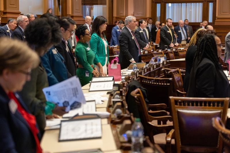 Legislators recently stood during an announcement at the House of Representatives in Atlanta. On Thursday, the House passed the all-important midyear budget. (Arvin Temkar/The Atlanta Journal-Constitution)