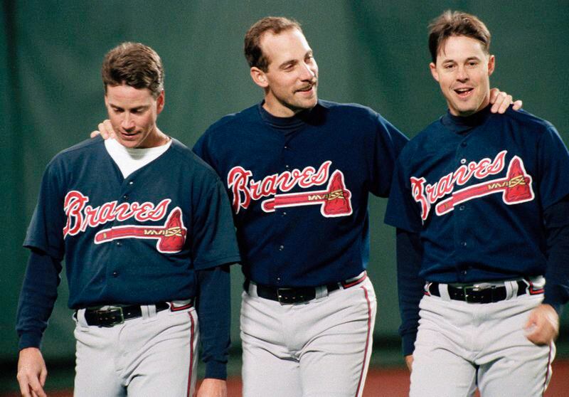 Atlanta Braves pitchers from left, Tom Glavine, John Smoltz and Greg Maddux have a moment together before their game with Philadelphia Phillies at Veterans Stadium, on Oct. 6, 1993.(AP Photo/Doug Mills) Smoltz (middle) could join his Big Three pitching mates, Tom Glavine (left) and Greg Maddux (right), who both were elected to the HOF a year ago in their first time on the ballot.