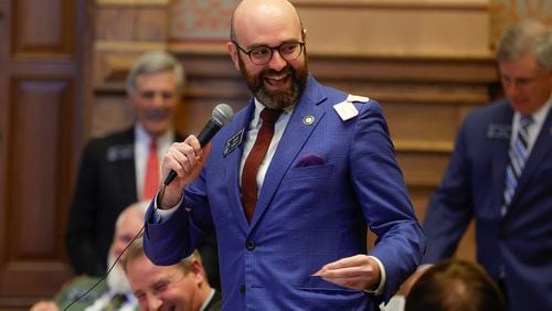 Sen. Josh McLaurin (D-Sandy Springs) laughs after Sen. John Albers (R-Roswell)  throws paper on him after making an early motion to adjourn early on Sine Die at the State Capitol on Wednesday, March 29, 2023.  (Natrice Miller/ natrice.miller@ajc.com)