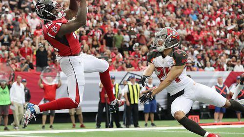 September 11, 2016 ATLANTA: Falcons wide receiver Mohamed Sanu catches a touchdown pass past Buccaneers cornerback Brent Grimes for a 10-3 lead during the first quarter in an NFL football game on Sunday, Sept. 11, 2016, in Atlanta. Curtis Compton /ccompton@ajc.com