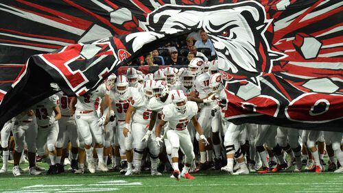 North Gwinnett football players run onto the field before the start of their game against the Brookwood at the Corky Kell Classic Saturday, Aug. 18, 2018, at Mercedes-Benz Stadium in Atlanta.