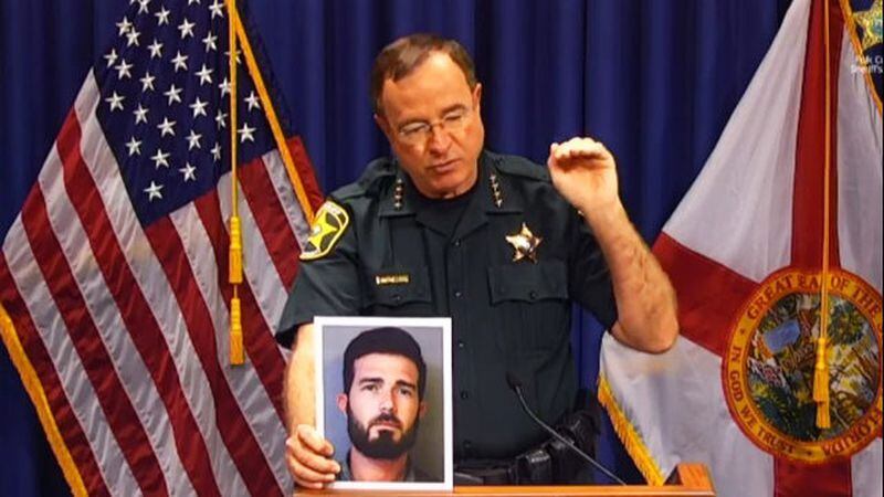Polk County Sheriff Grady Judd holds a photo of Jason Boek, 34, after he was shot and killed by an Uber on Tuesday, Aug. 28, 2018, in a case described by authorities as a justifiable homicide.