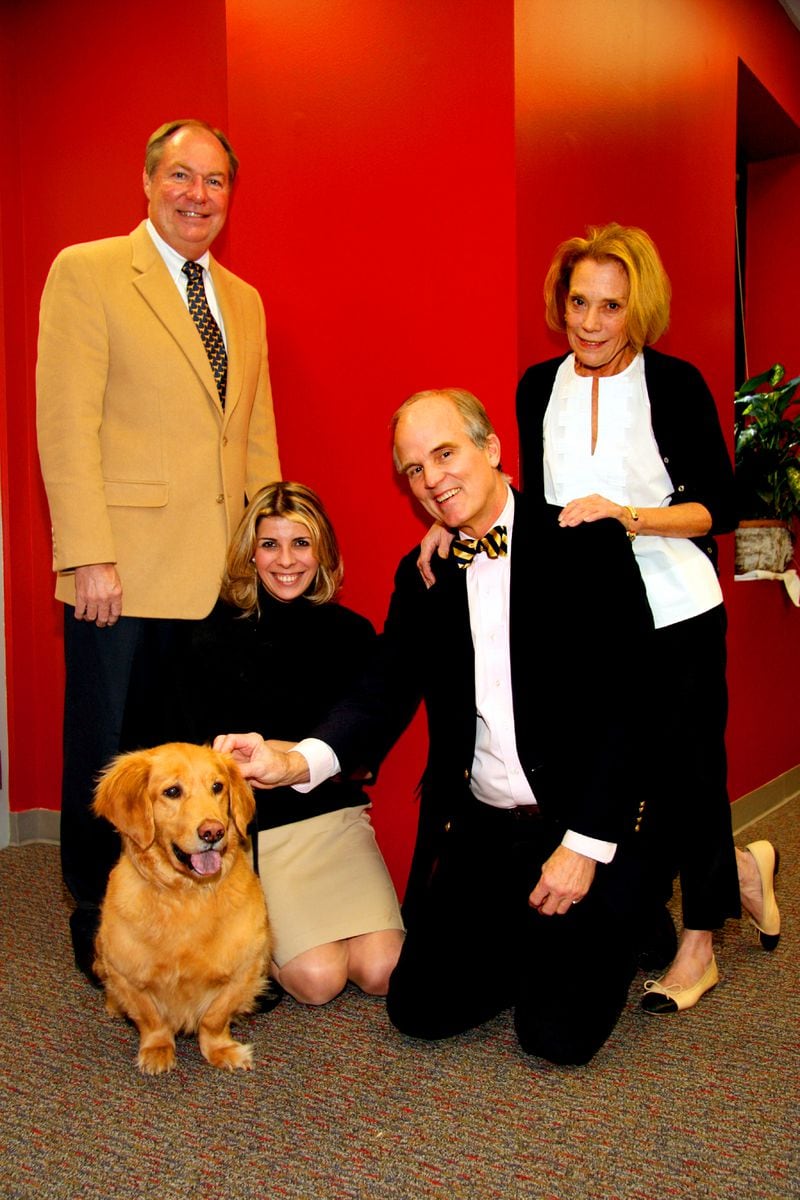Varsity Jr. owner Susan Gordy was also known for her love of dogs. In a photo promoting the 2009 Atlanta Humane Society calendar are (from left) then-Atlanta Humane Society President Carl Leveridge, December "calendar dog" Jake and owner Kathy Akopov, Cotten Alston and Susan Gordy. Courtesy of Kim Link