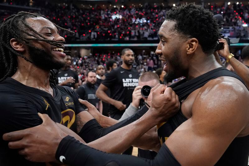 Cleveland Cavaliers' Darius Garland, left, and Donovan Mitchell celebrate after defeating the Orlando Magic in Game 7 of an NBA basketball first-round playoff series, Sunday, May 5, 2024, in Cleveland. (AP Photo/Sue Ogrocki)